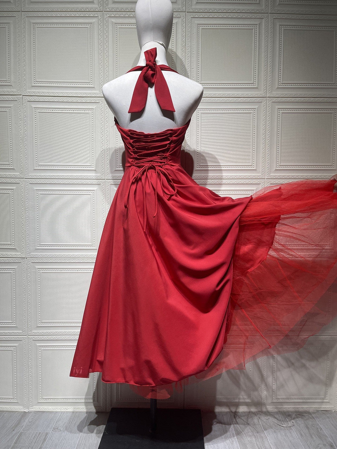 Marlene midi dress with a neck tie, open back, and tulle trim