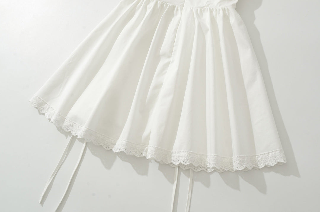 A-line mini dress with tie and button embellishments – Vanessa