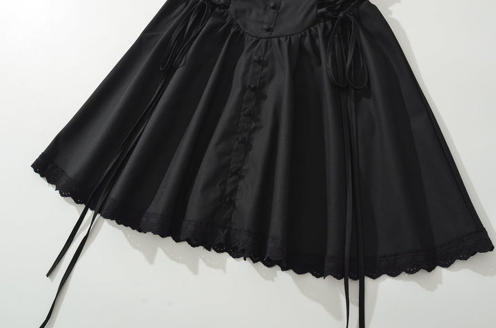 A-line mini dress with tie and button embellishments – Vanessa