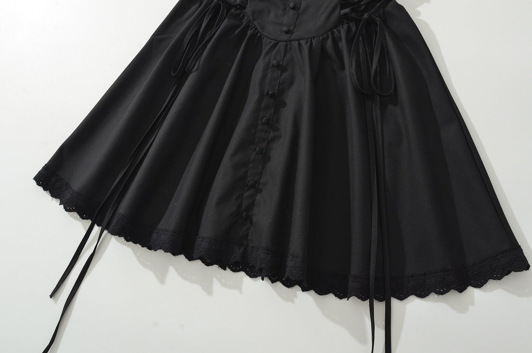 A-line mini dress with tie and button embellishments – Vanessa
