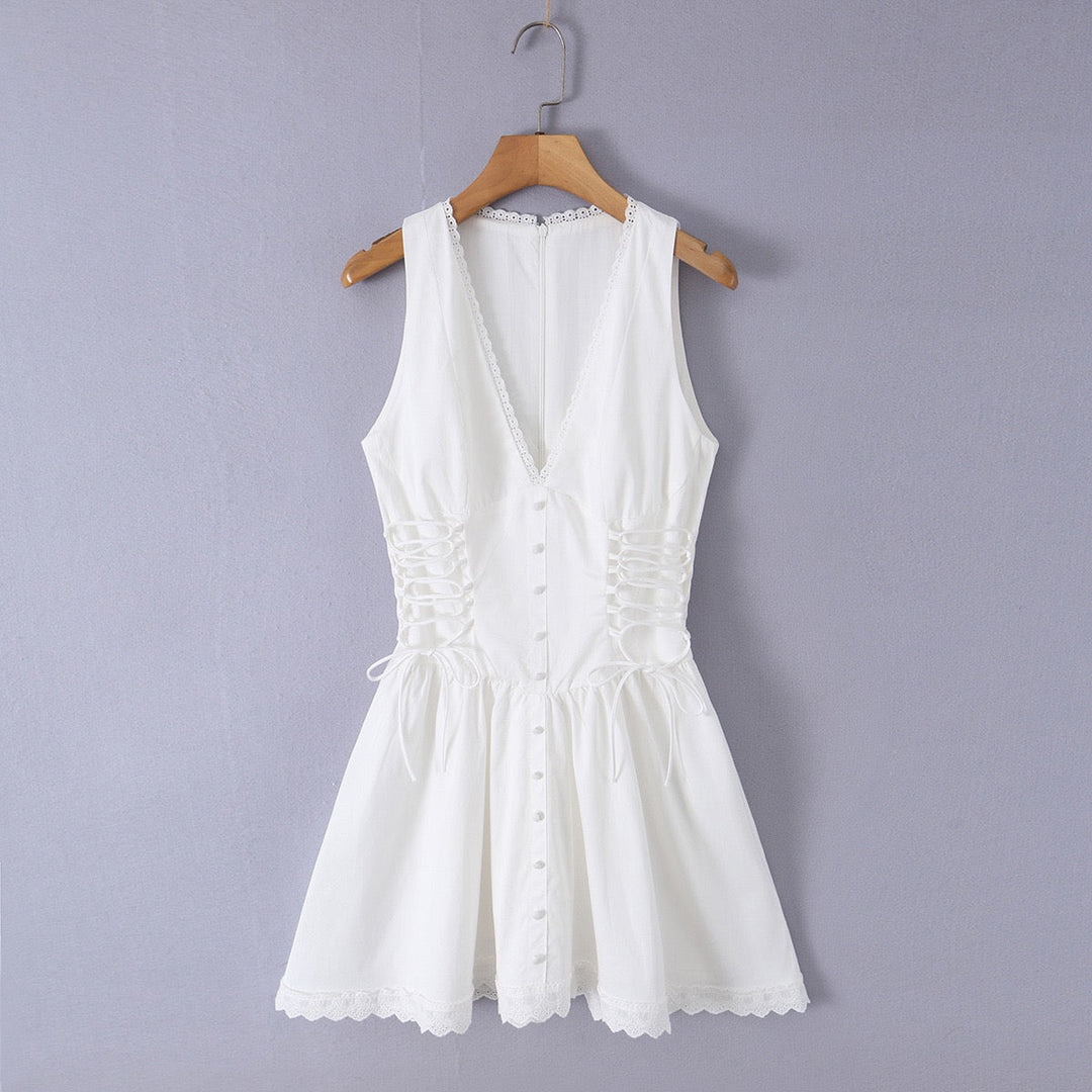 A-line mini dress with tie and button embellishments – Vanessa