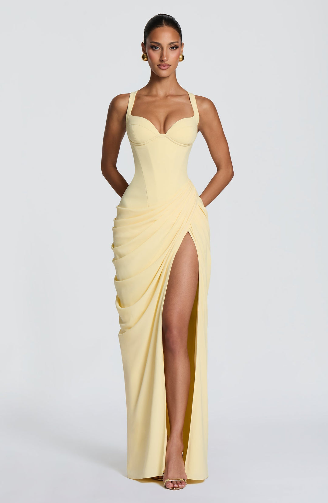 Layla maxi dress with a slit, pleats, corset design, back tie, and waist-cinching fit