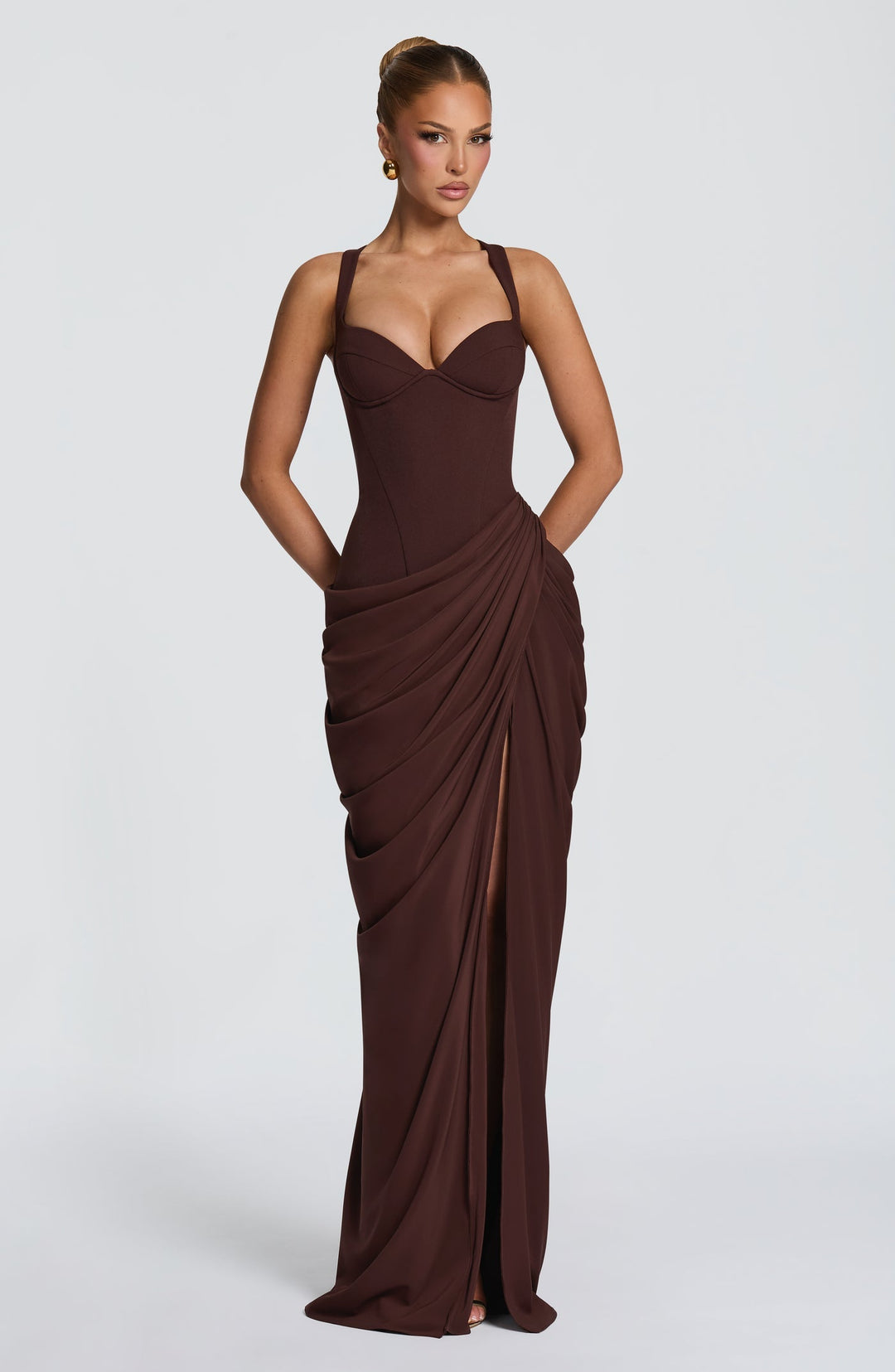 Layla maxi dress with a slit, pleats, corset design, back tie, and waist-cinching fit