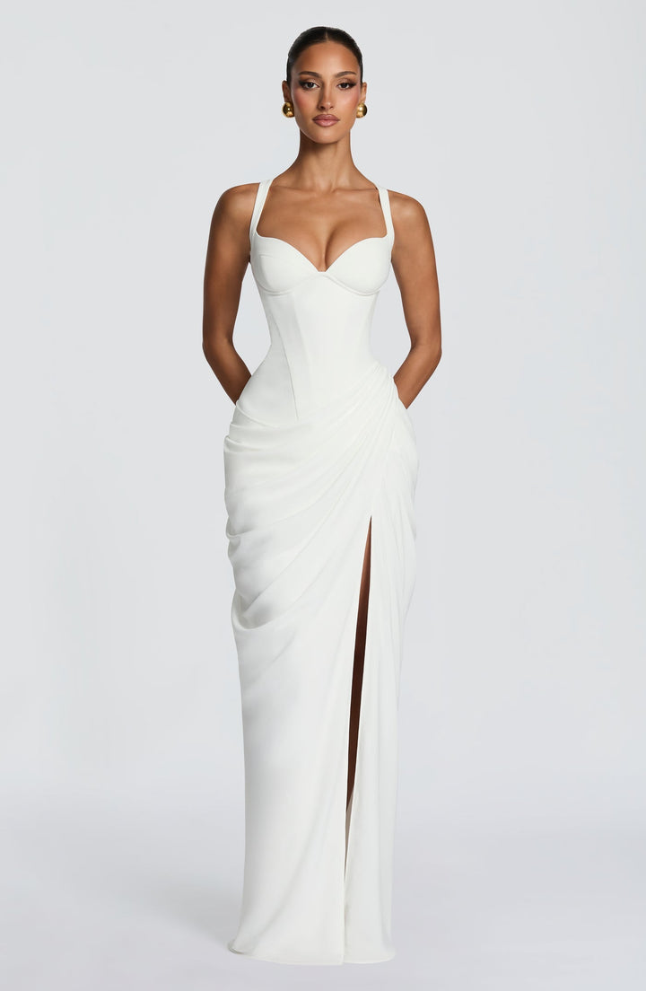 Layla maxi dress with a slit, pleats, corset design, back tie, and waist-cinching fit