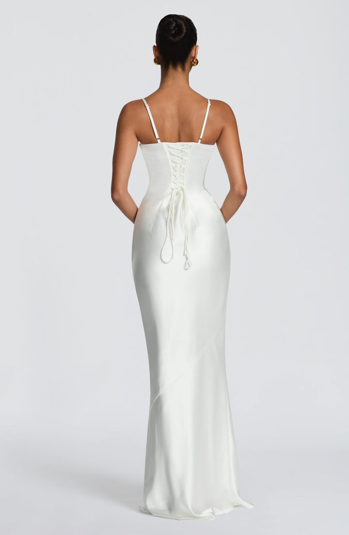 Alaia satin maxi dress with a back tie and waist-cinching design
