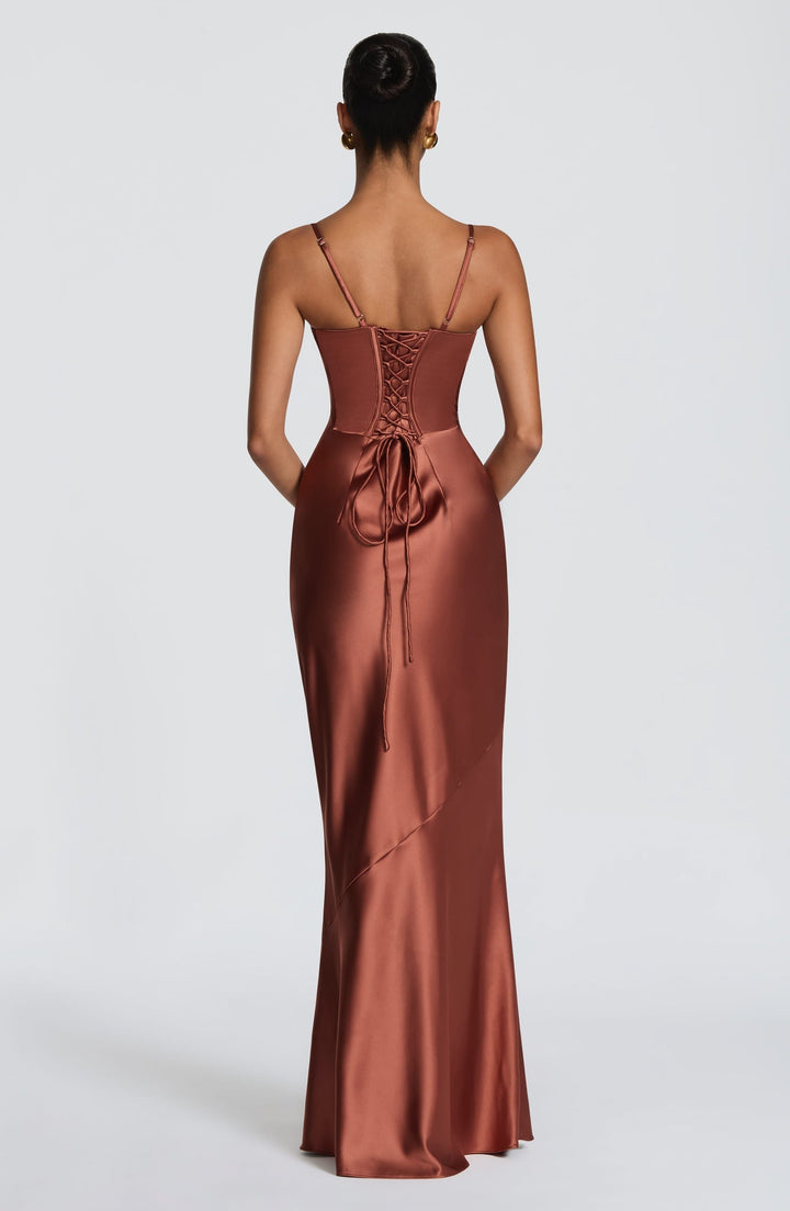 Alaia satin maxi dress with a back tie and waist-cinching design