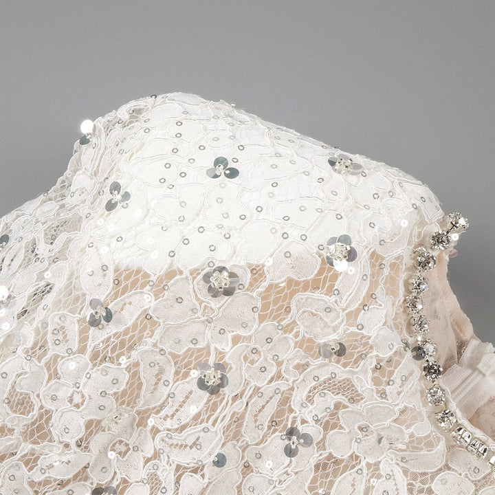 Lace mini dress with sequin and rhinestone embellishments and a chiffon train - MAXIMA
