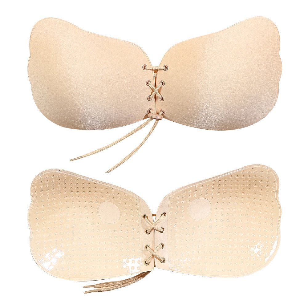 Adhesive strapless bra for securing the breasts