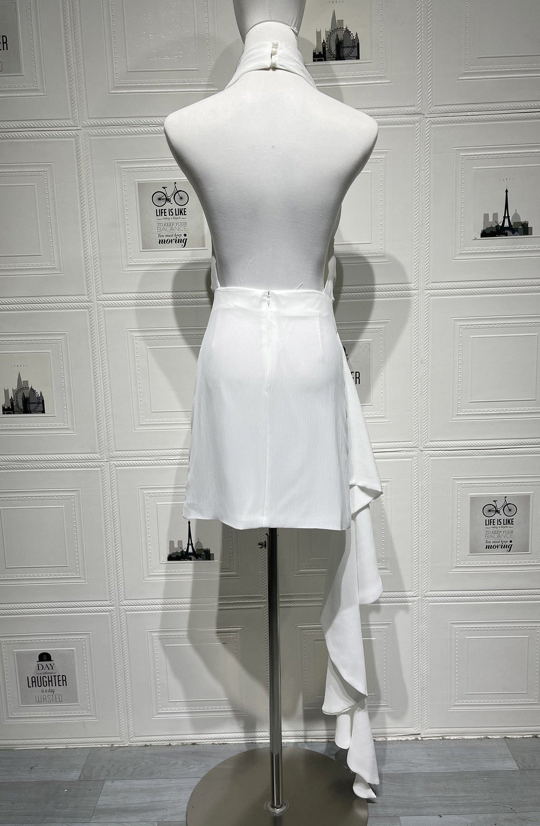 Lilian satin halter mini dress with an open back and train detail