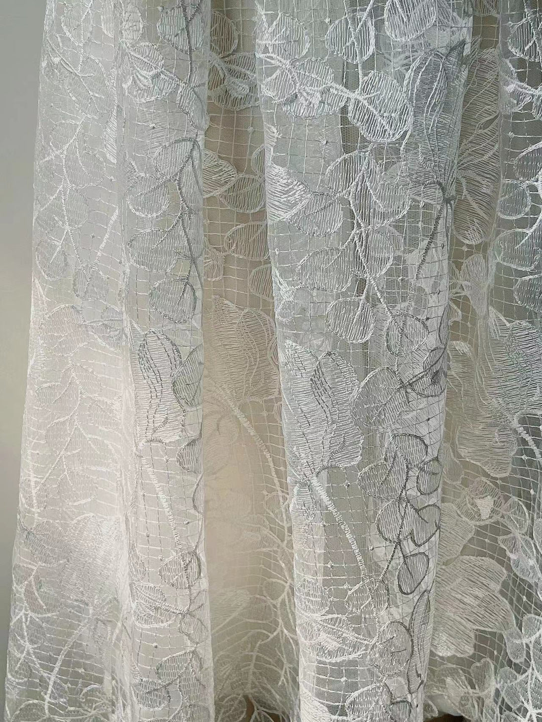 Rosalie strapless midi dress with a shiny floral embroidery design