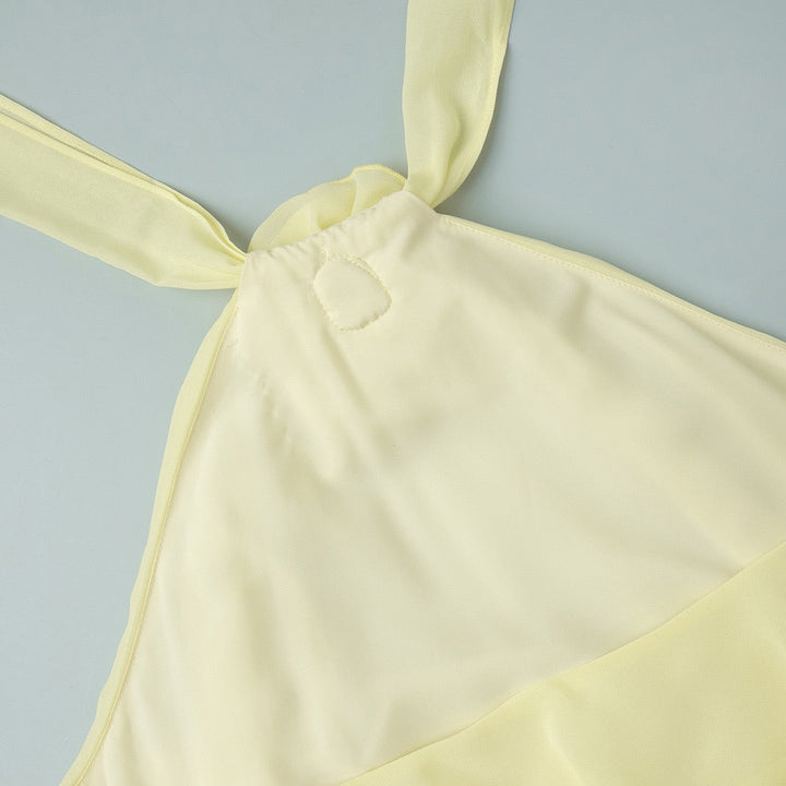 Lily tiered chiffon ruffle mini dress with a neck tie, open back, and floral trim