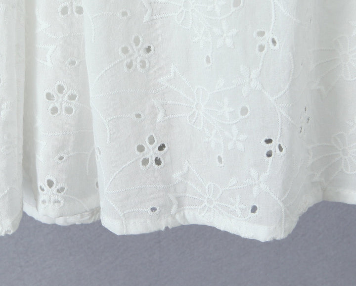 A-line mini dress in embroidered eyelet fabric with back ties for a fitted waist – Vנס