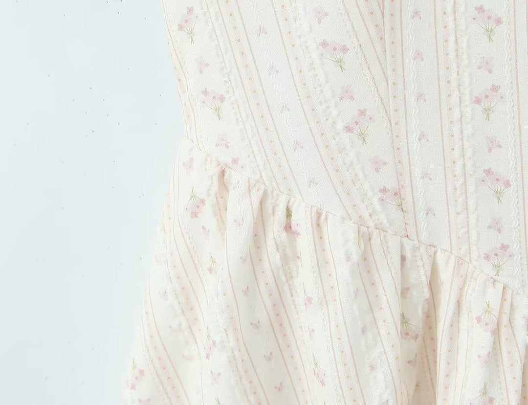 Floral A-line mini dress with an open back – Nelly