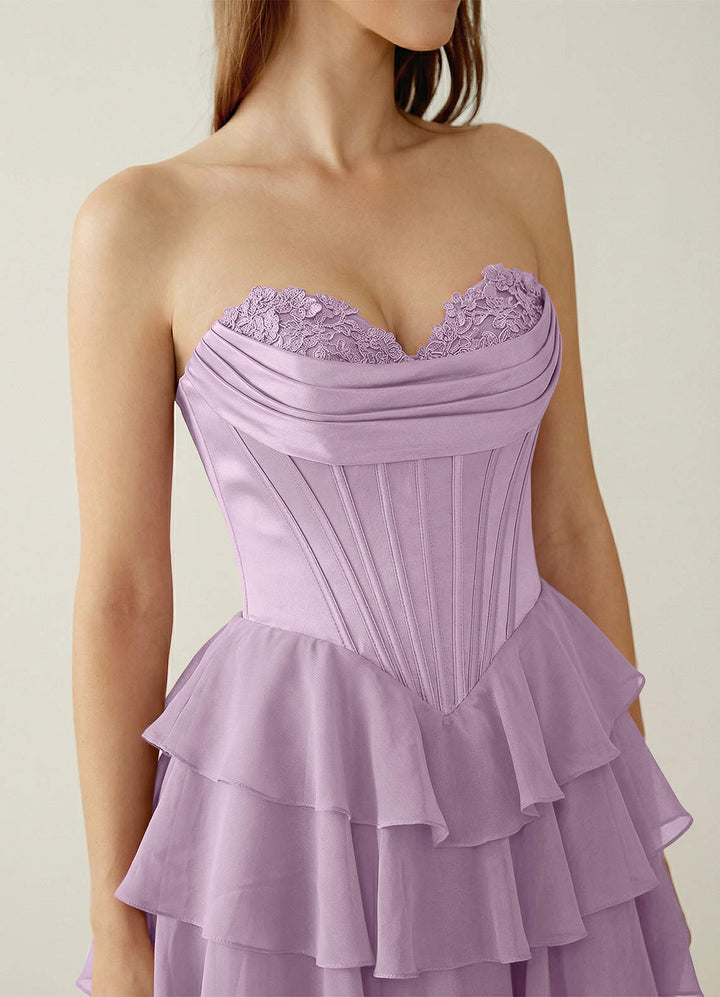SHERY strapless ruffle maxi dress with a corset design, back tie, waist-cinching fit, and slit