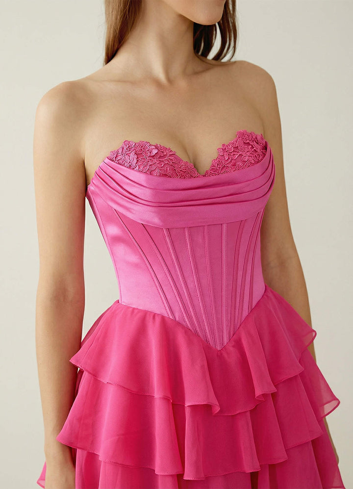 SHERY strapless ruffle maxi dress with a corset design, back tie, waist-cinching fit, and slit