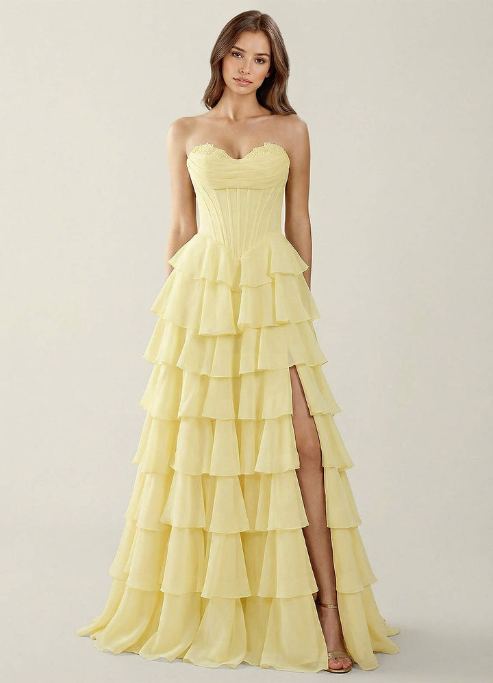 SHERY strapless ruffle maxi dress with a corset design, back tie, waist-cinching fit, and slit