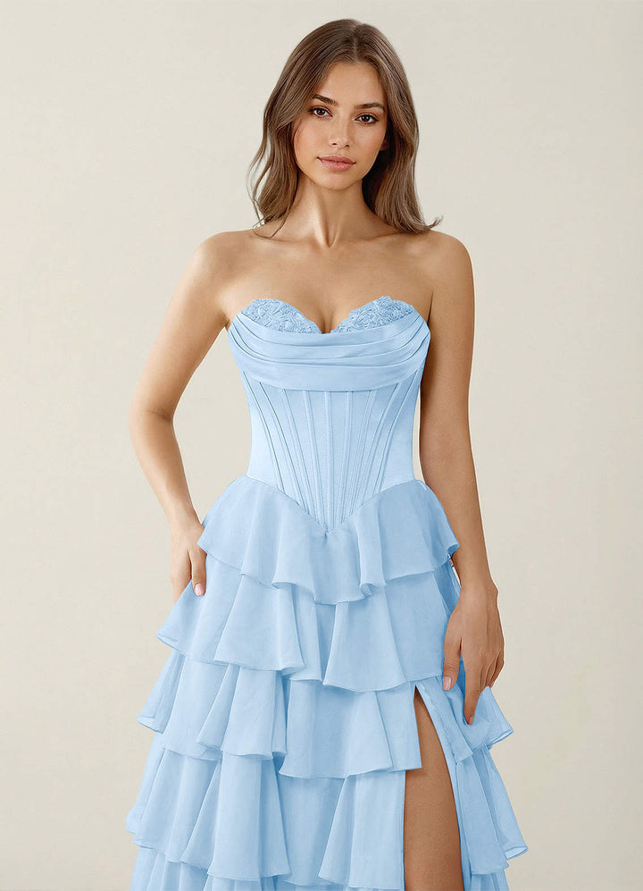 SHERY strapless ruffle maxi dress with a corset design, back tie, waist-cinching fit, and slit
