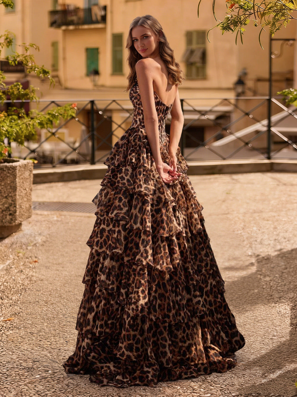 SHERY strapless ruffle maxi dress with a corset design, back tie, waist-cinching fit, and slit