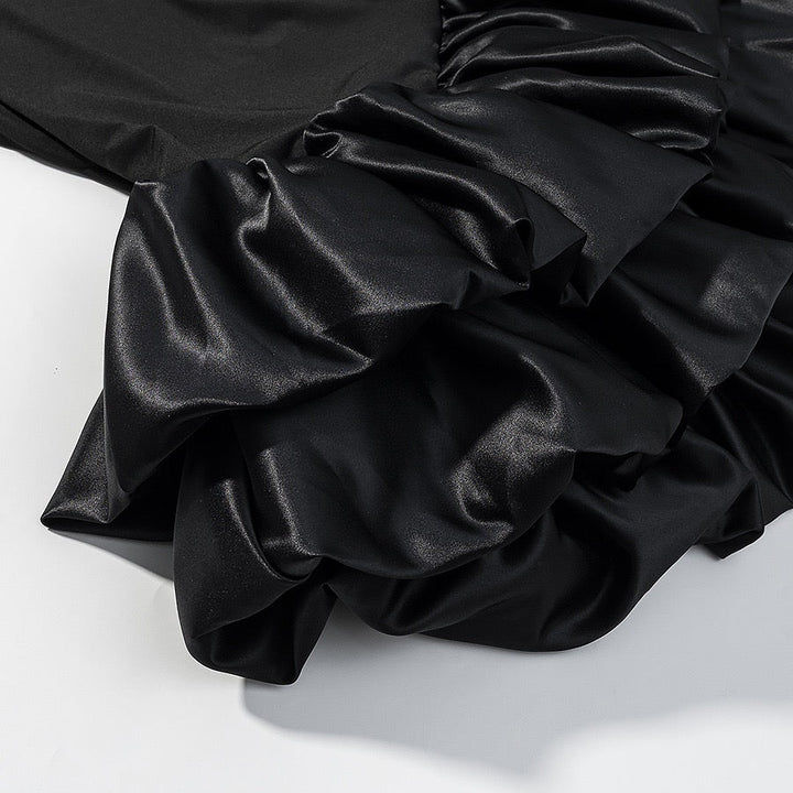 Tiered balloon mini dress with a turtleneck, neck ties, and an open back – DASSY