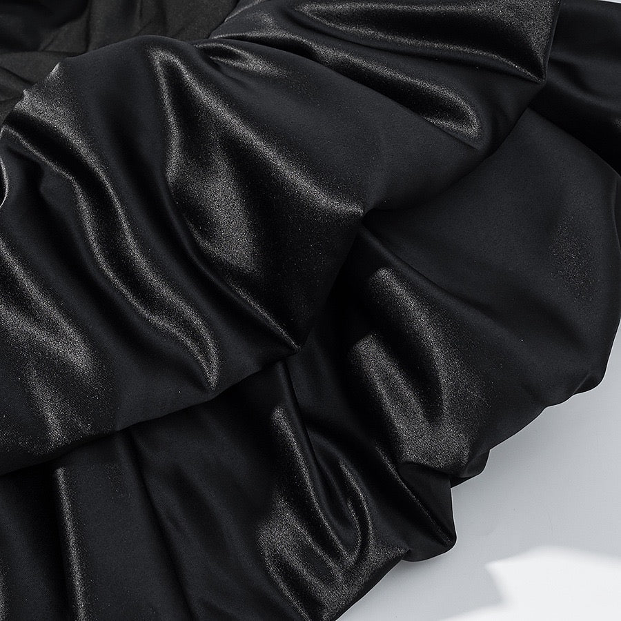 Tiered balloon mini dress with a turtleneck, neck ties, and an open back – DASSY
