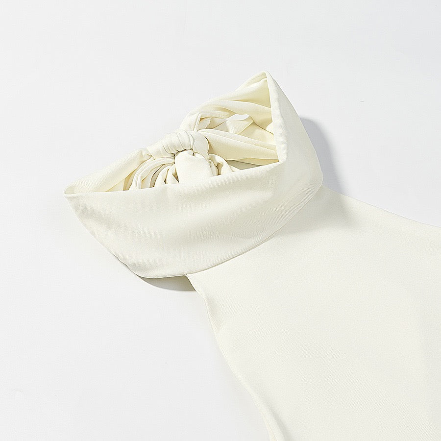 Tiered balloon mini dress with a turtleneck, neck ties, and an open back – DASSY