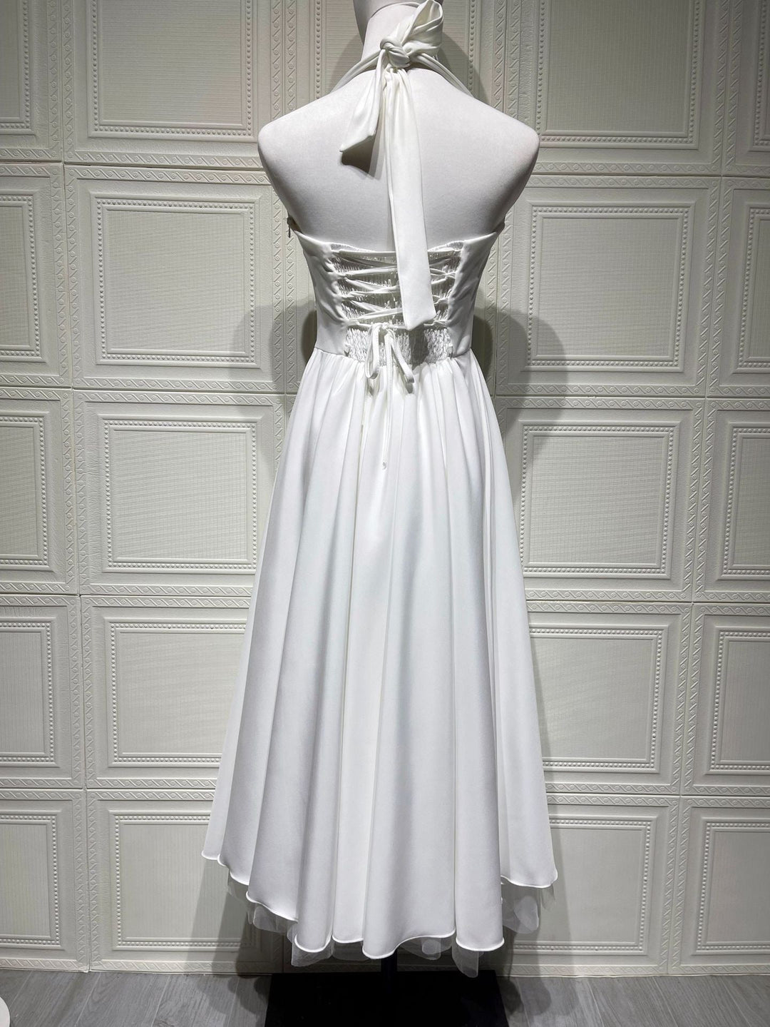 Marlene midi dress with a neck tie, open back, and tulle trim