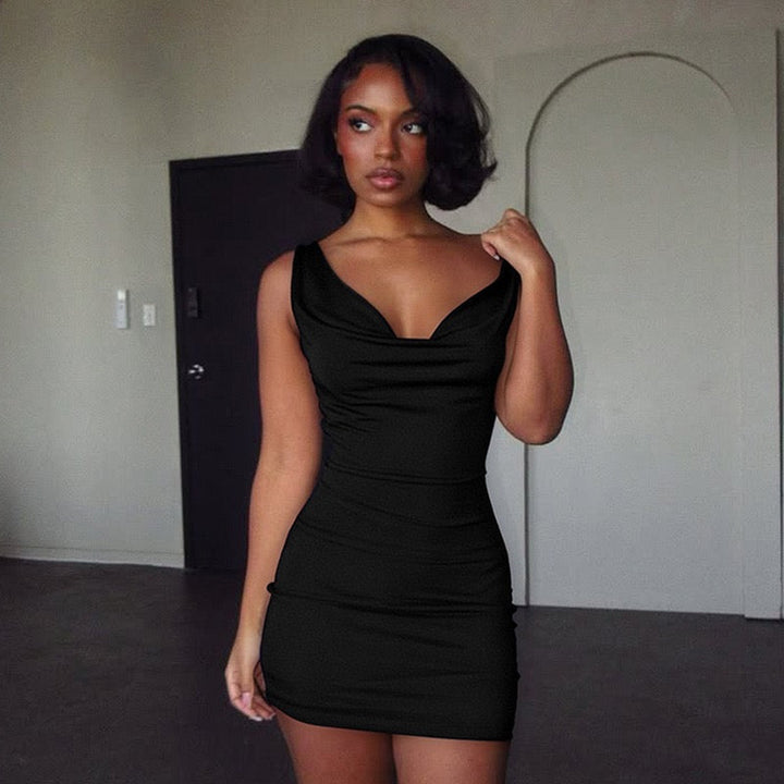 Mini dress with pleated design, open back, and stone chain decoration - SIA