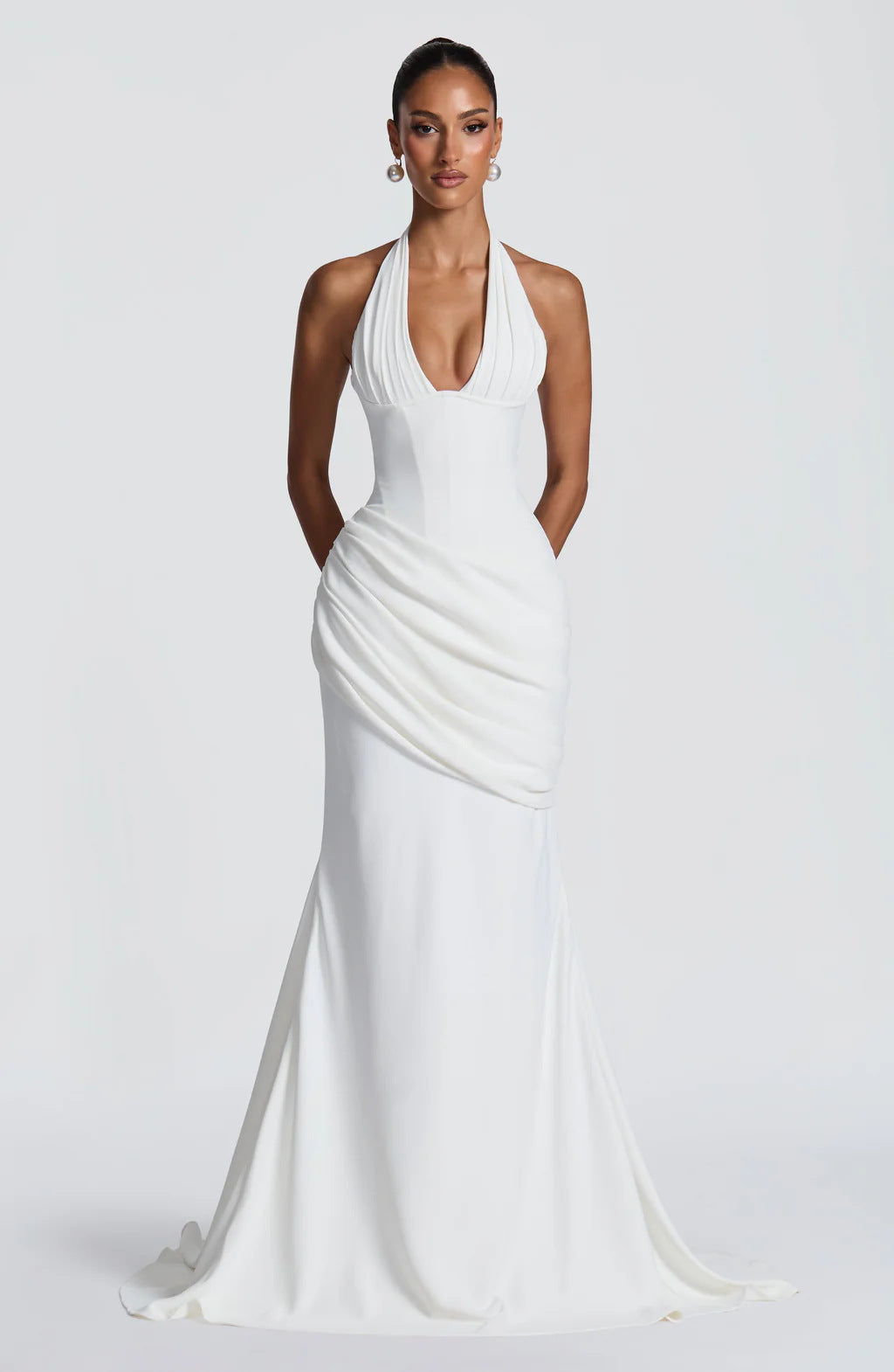 Erin maxi dress with an open back, a back tie for a fitted waist, and a pleated design