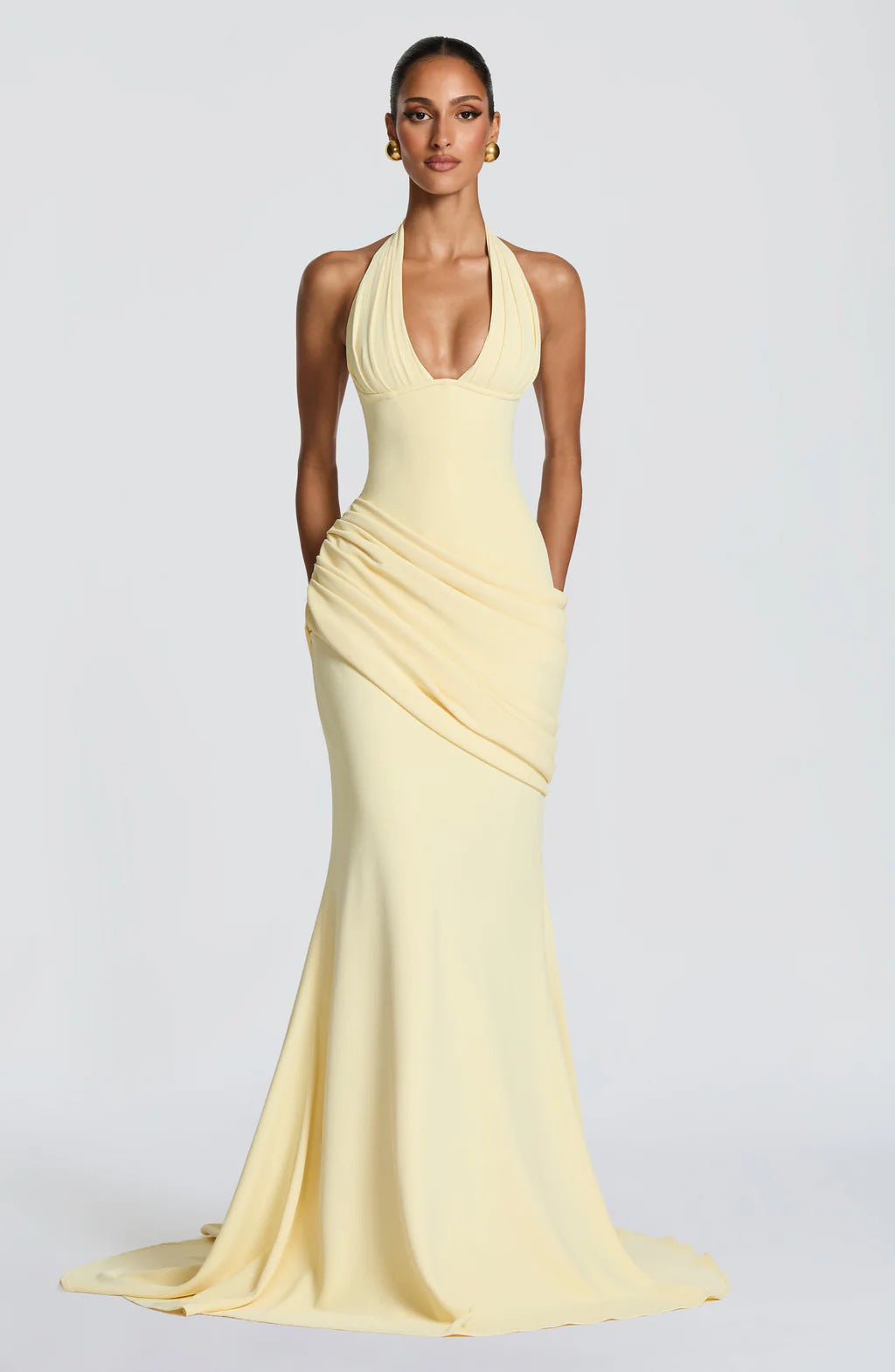 Erin maxi dress with an open back, a back tie for a fitted waist, and a pleated design