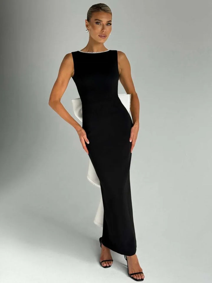 Elegant maxi dress with open back, bow, and pearl decoration - Alberta