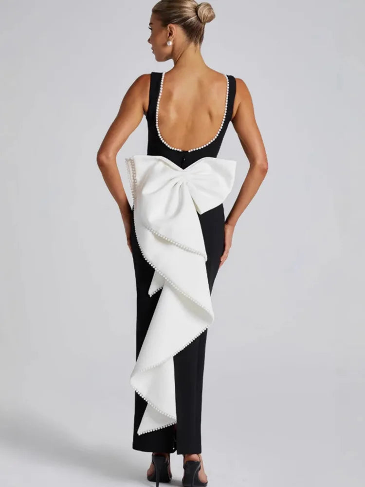 Elegant maxi dress with open back, bow, and pearl decoration - Alberta