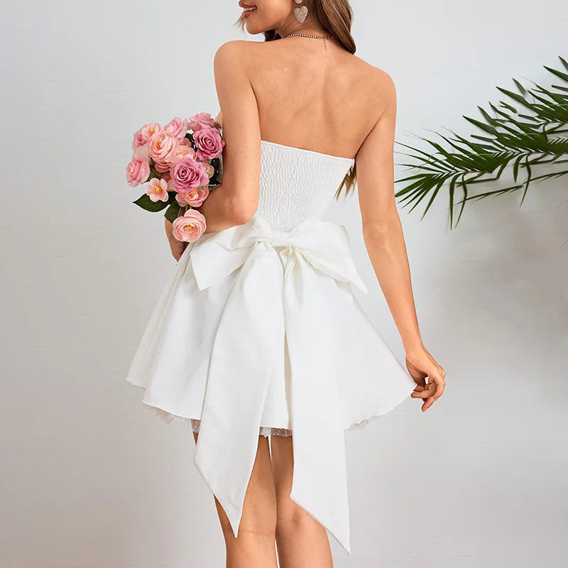 Strapless mini dress with bow detail on the back and added tulle underskirt - Novalee