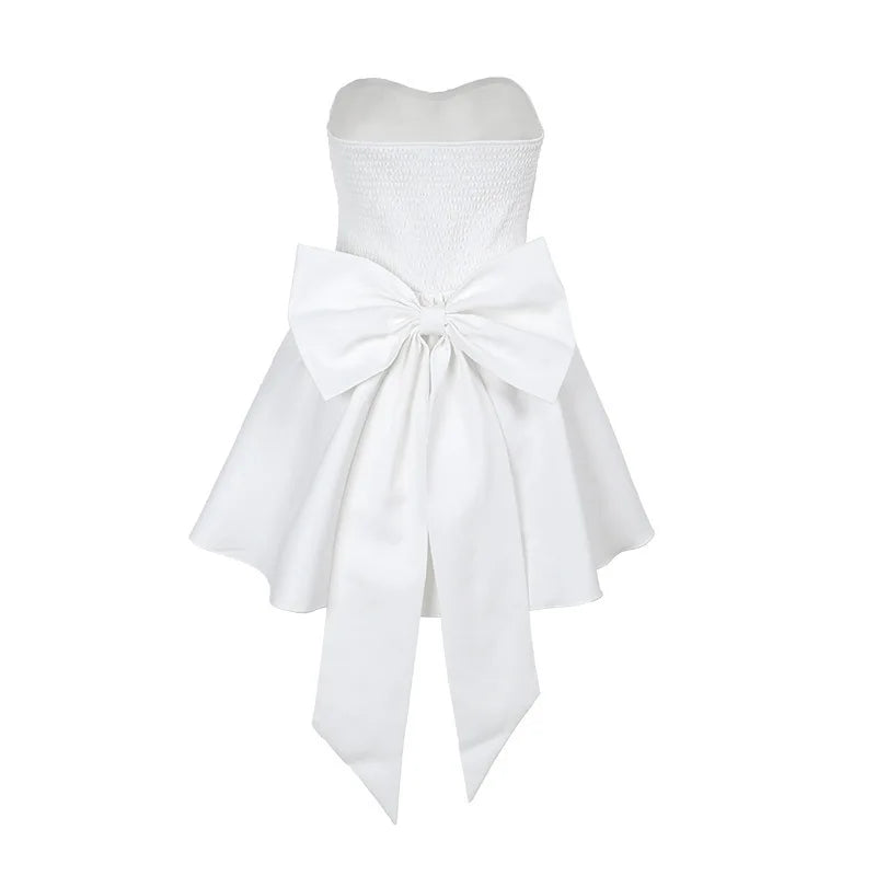 Strapless mini dress with bow detail on the back and added tulle underskirt - Novalee