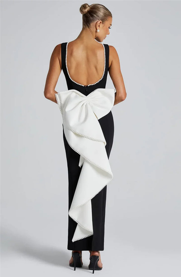 Elegant maxi dress with open back, bow, and pearl decoration - Alberta