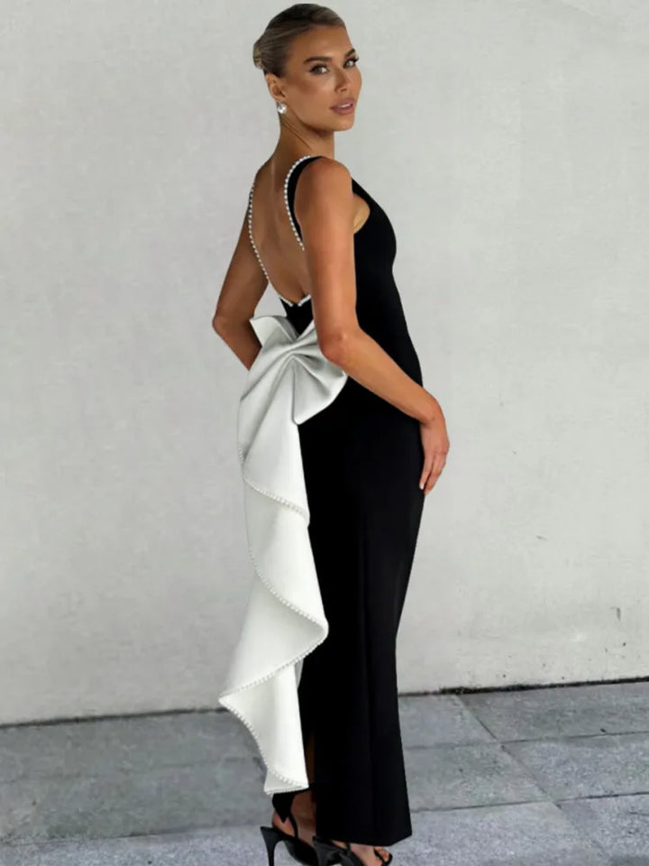 Elegant maxi dress with open back, bow, and pearl decoration - Alberta
