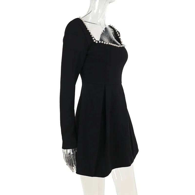 A-line mini dress decorated with pearls - Cory