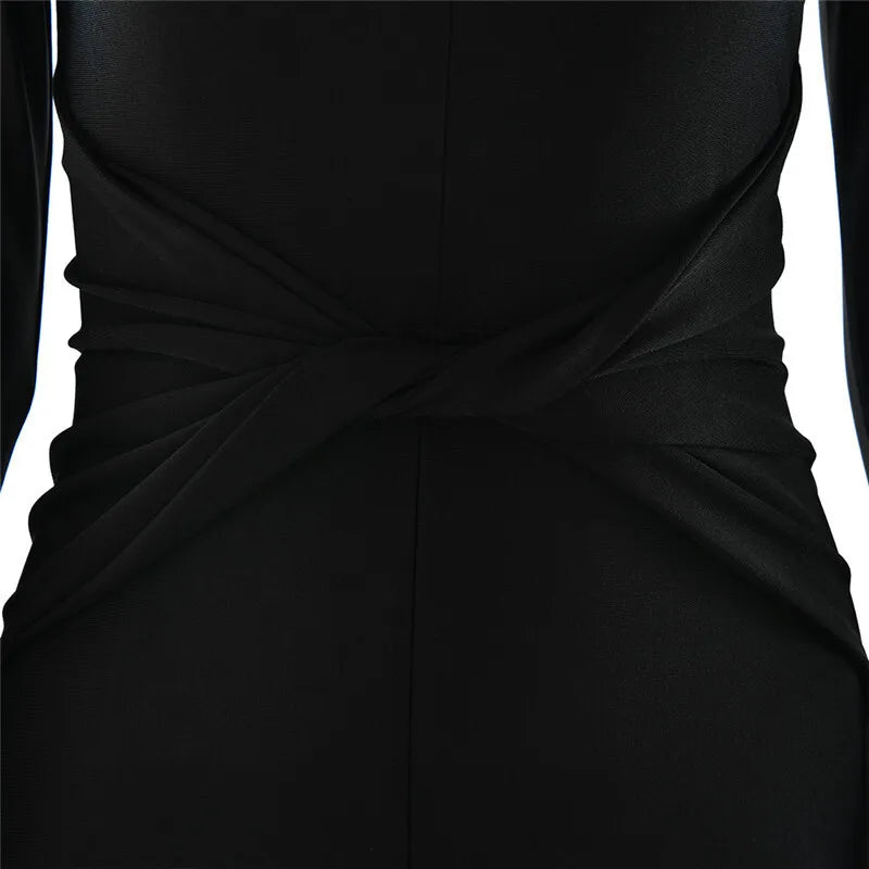 Fitted long jumpsuit with shaping fabric, deep V neckline, and cross decoration - Laini