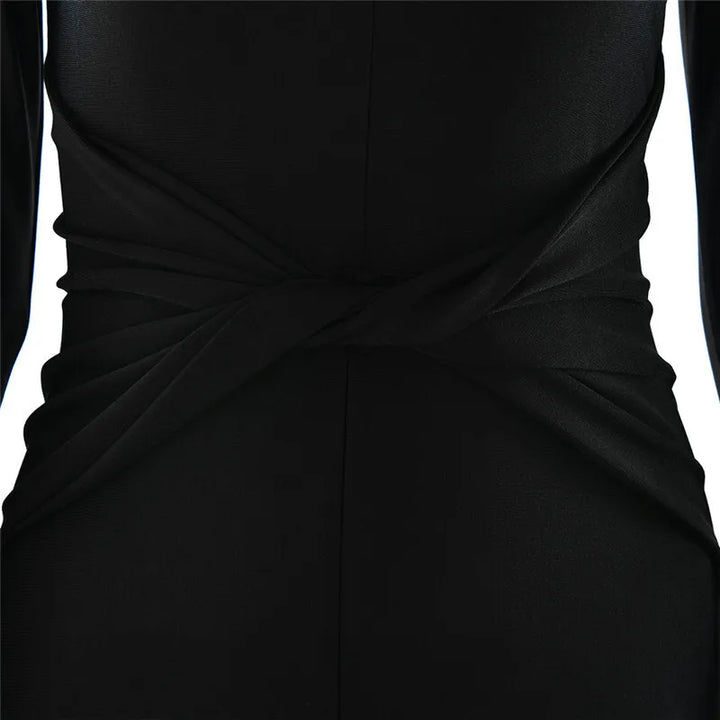 Fitted long jumpsuit with shaping fabric, deep V neckline, and cross decoration - Laini