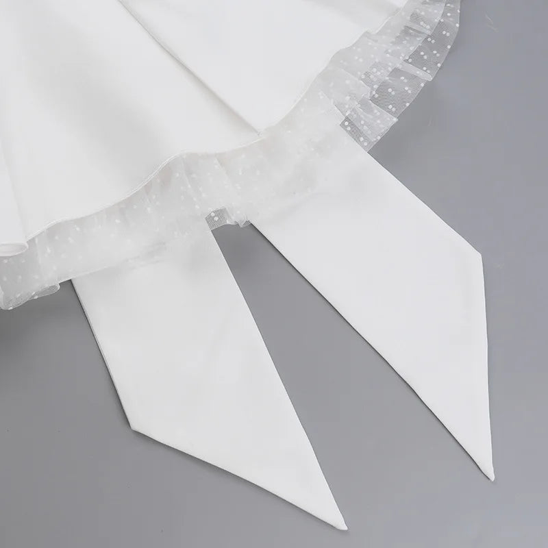 Strapless mini dress with bow detail on the back and added tulle underskirt - Novalee