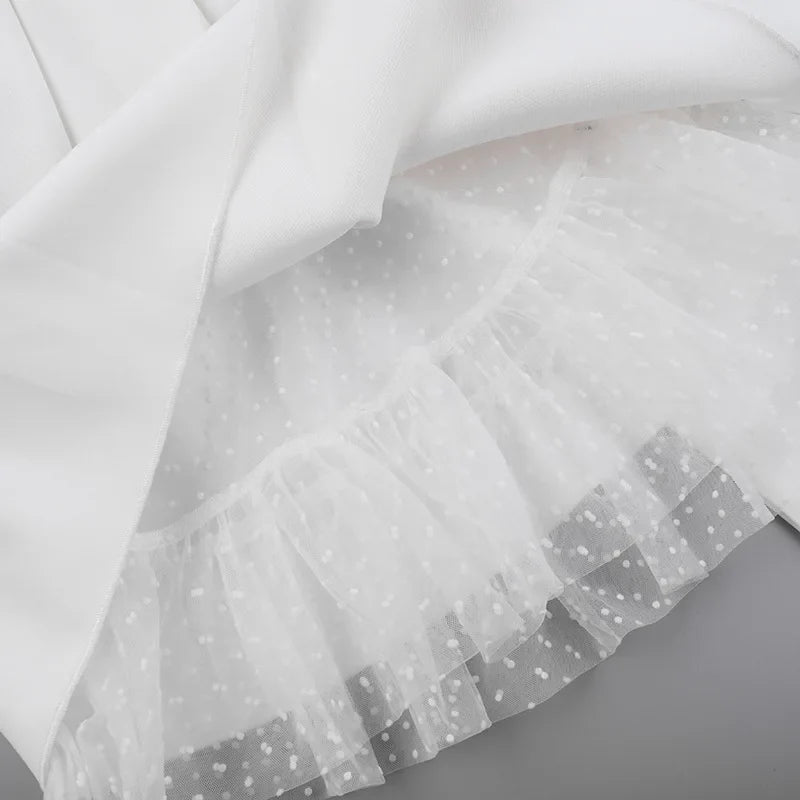 Strapless mini dress with bow detail on the back and added tulle underskirt - Novalee