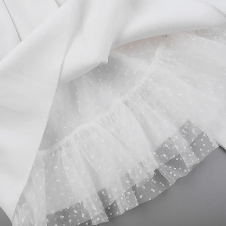 Strapless mini dress with bow detail on the back and added tulle underskirt - Novalee