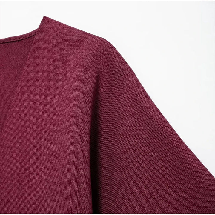 Elegant sweater with gold button decoration - Nela