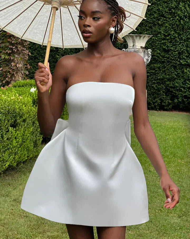 Satin mini dress in A-line cut with tie bow back detail for waist fit - Lilia