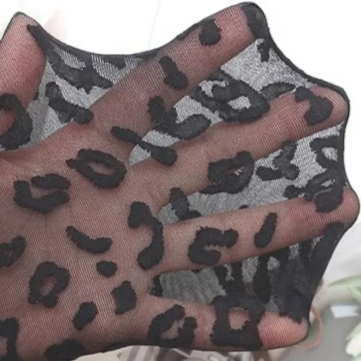 Sheer tights with a leopard print design
