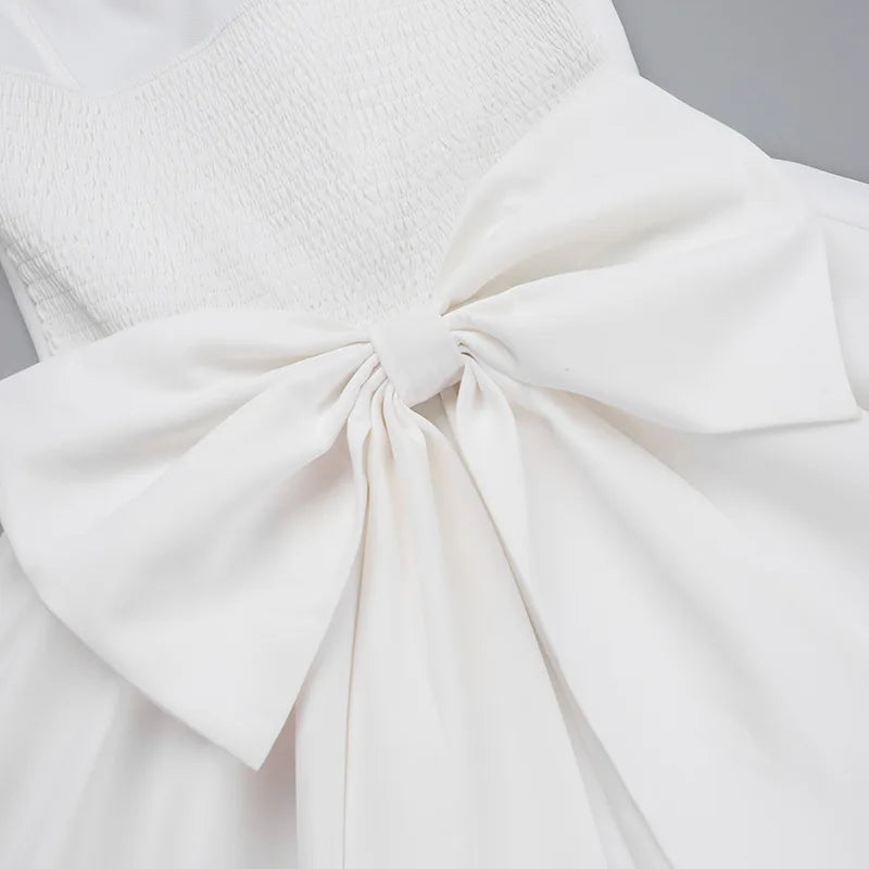 Strapless mini dress with bow detail on the back and added tulle underskirt - Novalee