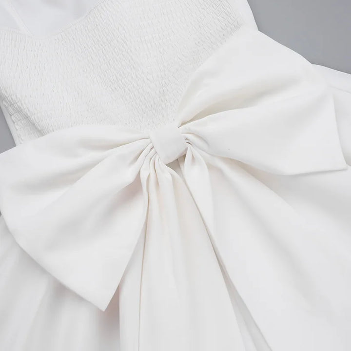 Strapless mini dress with bow detail on the back and added tulle underskirt - Novalee