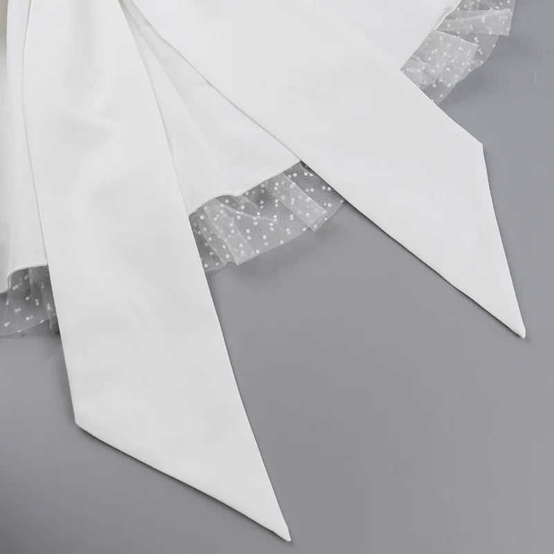 Strapless mini dress with bow detail on the back and added tulle underskirt - Novalee