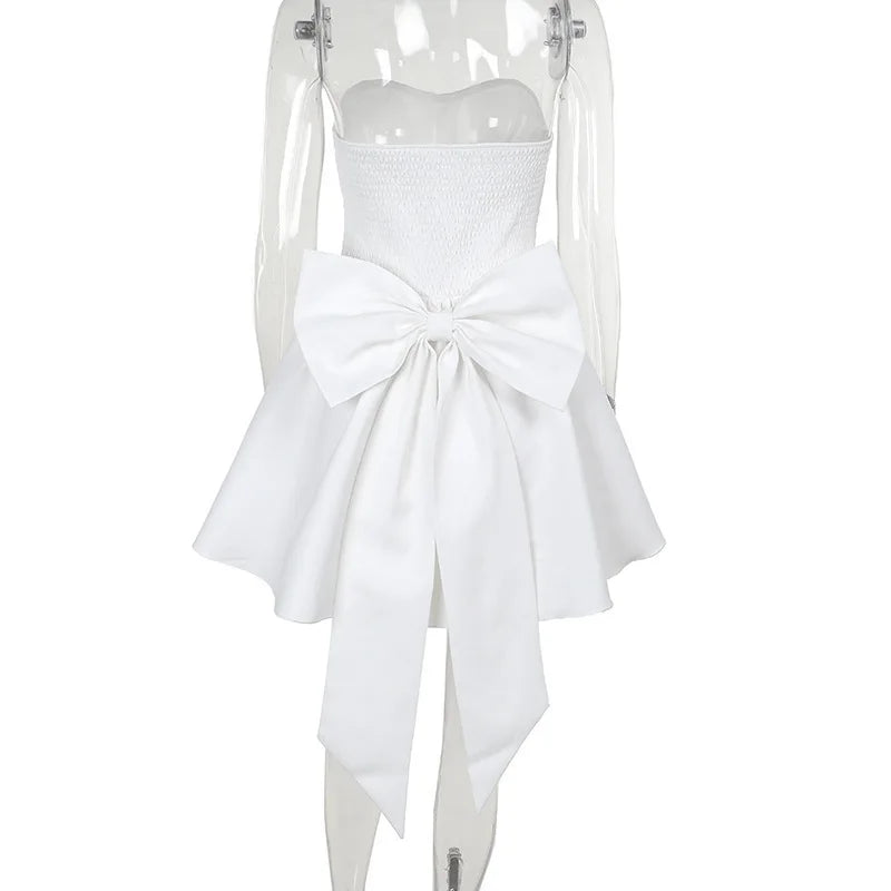 Strapless mini dress with bow detail on the back and added tulle underskirt - Novalee