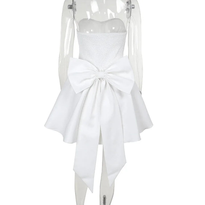 Strapless mini dress with bow detail on the back and added tulle underskirt - Novalee
