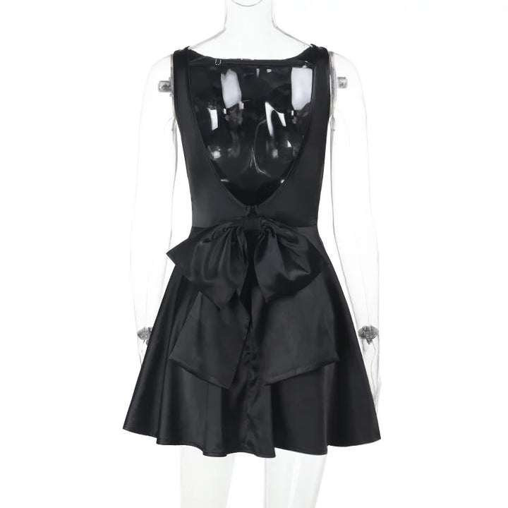 Silk satin mini dress in A-line cut with open back and bow detail - ELLIE
